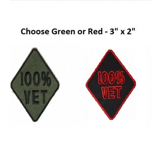 May include: Two diamond-shaped patches, one green and one black, with the text "100% VET" in black and red embroidery. The patches are 3 inches by 2 inches.