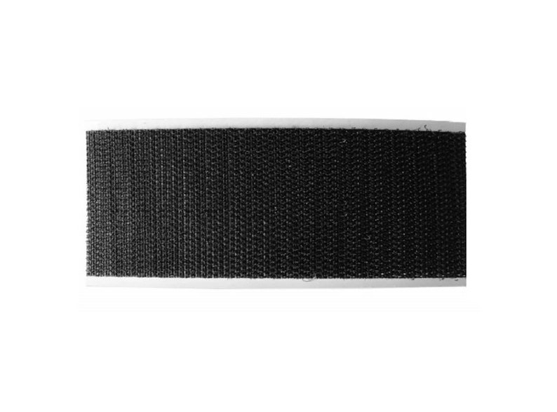 May include: Black hook and loop tape, also known as Velcro, with a white backing.