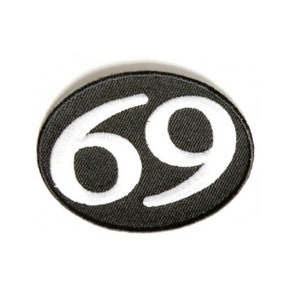 May include: Black oval patch with white embroidered number 69.