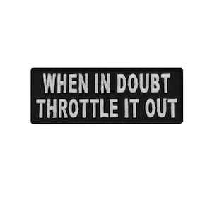 May include: Black embroidered patch with white text that reads "When in doubt throttle it out".