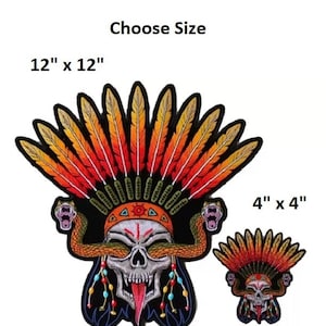May include: Embroidered patch featuring a skull with a Native American headdress and snakes. The patch is available in two sizes: 12" x 12" and 4" x 4". The skull has a red tongue and is surrounded by colorful feathers.