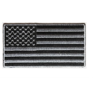 May include: Black and silver embroidered American flag patch.