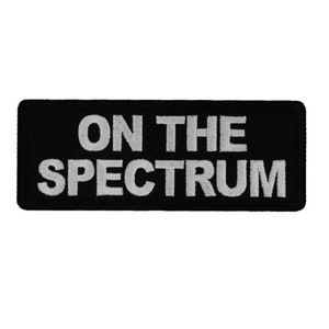 ON THE SPECTRUM 4&quot; x 1.5&quot; iron on patch (7239) Autism Awareness (J11)