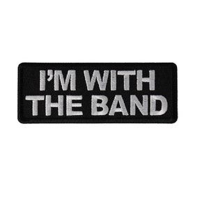 May include: Black embroidered patch with white text that reads "I'M WITH THE BAND".