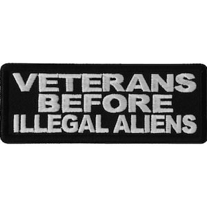 May include: Black and white embroidered patch with the text "Veterans Before Illegal Aliens".