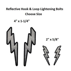May include: Two pairs of reflective hook and loop lightning bolt patches. The larger pair is 4 inches by 1 and 1/4 inches. The smaller pair is 2 inches by 5/8 inches.