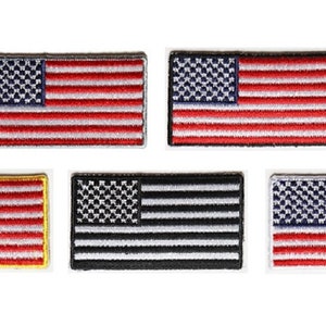 May include: Five embroidered American flag patches. The patches are in different color combinations: red, white, and blue; black and white; and blue, white, and red.