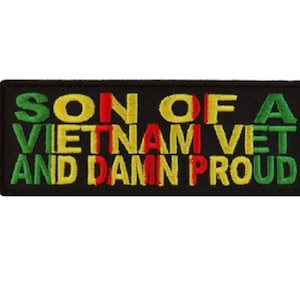 May include: Black embroidered patch with the text "Son of a Vietnam Vet and Damn Proud" in yellow, red, and green lettering.