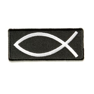 May include: A black fabric patch with a white embroidered Ichthys symbol, also known as the Jesus fish.