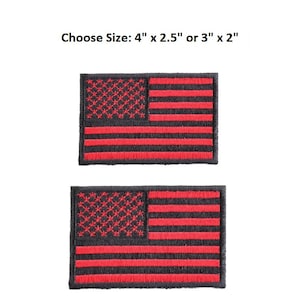 May include: Two embroidered patches featuring the American flag design. The flag has red stripes and a field of red stars on a black background. The text "Choose Size: 4" x 2.5" or 3" x 2"" is above the patches.