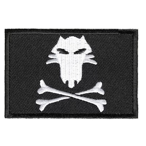 May include: Black embroidered patch with a white skull and crossbones design. The skull has a wolf-like face with sharp teeth and angry eyes.