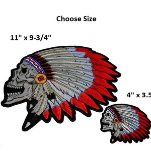 May include: Two embroidered iron-on patches of a skull wearing a Native American headdress. The larger patch is 11 inches by 9-3/4 inches. The smaller patch is 4 inches by 3.5 inches. Choose Size.