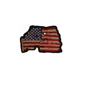 May include: A distressed American flag patch with a black border. The flag is faded and torn, with some of the stars missing.