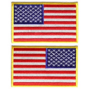 May include: Two embroidered American flag patches with a yellow border. The top patch has the stars in blue and the stripes in red and white. The bottom patch has the stars in blue and the stripes in red and white, but the stars are on the right side of the flag.