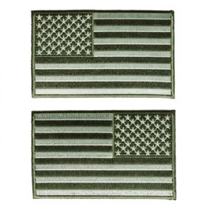 May include: Two green embroidered American flag patches. The flags are white with a green outline.