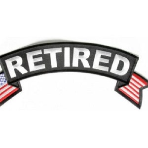 May include: Black and white embroidered patch with the word "RETIRED" in white lettering on a black banner with American flag accents on each end.