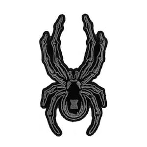 May include: Black embroidered spider patch with a skeletal design.