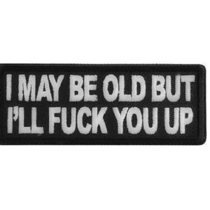 May include: A rectangular black embroidered patch with a white stitched border. The text I MAY BE OLD BUT I'LL FUCK YOU UP is embroidered in white capital letters across the center of the patch, featuring a bold, sans-serif font style.
