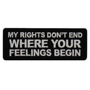 May include: Black and white embroidered patch with the text "MY RIGHTS DON'T END WHERE YOUR FEELINGS BEGIN".