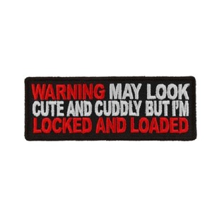 May include: Black embroidered patch with white and red text that reads "WARNING MAY LOOK CUTE AND CUDDLY BUT I'M LOCKED AND LOADED".