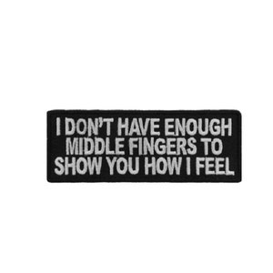 May include: Black and white embroidered patch with the text "I don't have enough middle fingers to show you how I feel."