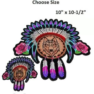 May include: Two embroidered iron-on patches featuring a wolf's head inside a dreamcatcher with feathers and roses. Choose between a 4" x 4" or 10" x 10-1/2" size.