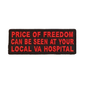 May include: Black embroidered patch with red text that reads "PRICE OF FREEDOM CAN BE SEEN AT YOUR LOCAL VA HOSPITAL."