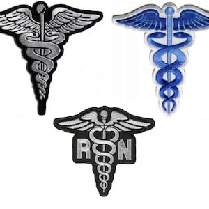 May include: Three embroidered iron-on patches featuring the medical symbol, a snake wrapped around a staff with wings. The first patch is silver, the second is blue, and the third is black with the letters "RN" below the symbol.