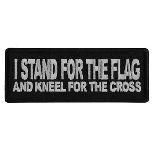 May include: Black embroidered patch with white text that reads "I Stand For The Flag And Kneel For The Cross".