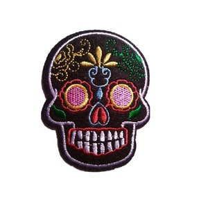 May include: Embroidered black sugar skull patch with colorful floral details, including pink, yellow, green, and blue accents.