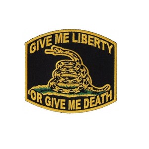 May include: A black and yellow embroidered patch with a coiled snake and the text "Give Me Liberty Or Give Me Death."