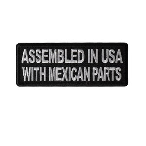 May include: Black embroidered patch with white text that reads "Assembled in USA with Mexican Parts".