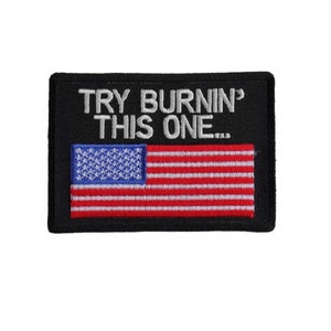 May include: A black embroidered patch with the text "TRY BURNIN' THIS ONE..." and an American flag.