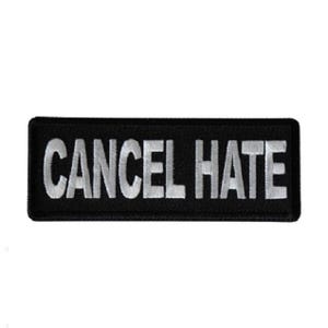 May include: A rectangular embroidered patch with a black background and a white border. The text CANCEL HATE is stitched in bold, white, capital letters across the center of the patch, featuring a clean, sans-serif font style throughout.