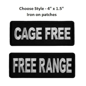 May include: Two black iron-on patches with white embroidery. The top patch reads "CAGE FREE" and the bottom patch reads "FREE RANGE".