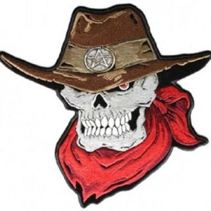 May include: Embroidered patch featuring a skull wearing a brown cowboy hat with a silver star emblem and a red bandana. The skull has a menacing expression with a red eye. The patch is likely for jackets, vests, or bags.