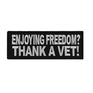 May include: Black and white embroidered patch with the text "ENJOYING FREEDOM? THANK A VET!"