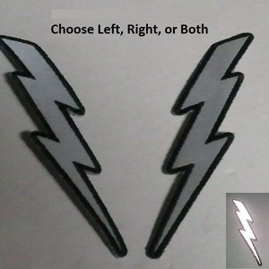 May include: Two silver reflective lightning bolt patches with black outlines. Choose left, right, or both.