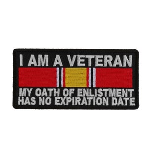 May include: Black embroidered patch with white text that reads "I am a Veteran. My oath of enlistment has no expiration date." The patch features a red, white, and gold ribbon.