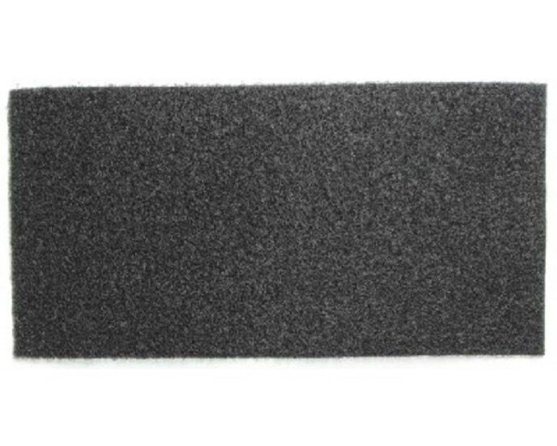 May include: A black foam sheet with a textured surface.