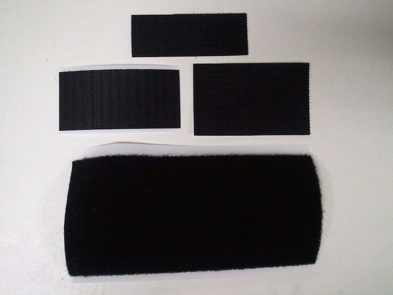 May include: Four pieces of black hook and loop fastener tape. The tape is in various sizes and shapes. The tape is designed to be used for attaching items together.