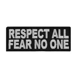 May include: Black embroidered patch with white text that reads "Respect All Fear No One".