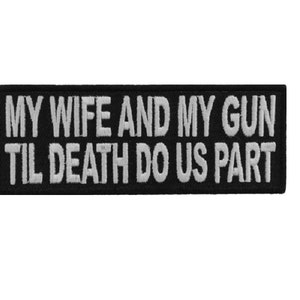 May include: Black and white embroidered patch with the text "MY WIFE AND MY GUN TIL DEATH DO US PART".
