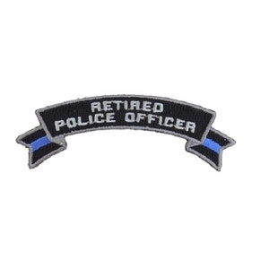 May include: Black and silver embroidered patch with a blue line. The patch reads "Retired Police Officer" on a curved banner.