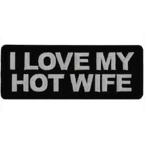 May include: Black embroidered patch with white text that reads "I LOVE MY HOT WIFE".