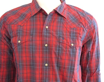 May include: A red and blue plaid long-sleeve button-down shirt with two chest pockets and a pointed collar.