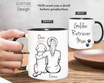 May include: White ceramic coffee mug with a black rim. The front of the mug features a black and white line drawing of a woman with a ponytail hugging a golden retriever dog. The dog has a halo above its head. The text "Dreo" is above the dog and "Emma" is below the woman. The back of the mug has the text "Golden Retriever Mom" with two paw prints.
