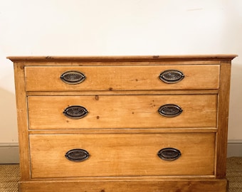 An antique Victorian pine chest of drawers