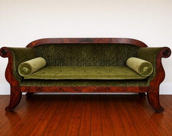 A 19th century French Empire period mahogany sofa