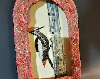 Ceramic shrine for Picoides tridactylus.